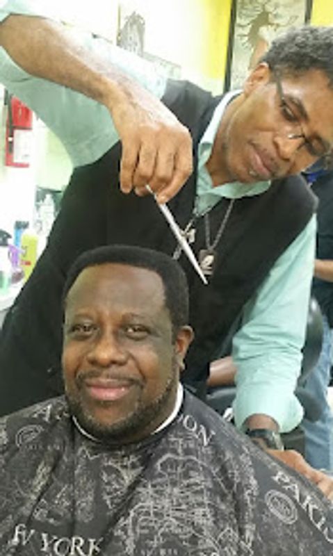 Man getting a haircut with a smile.