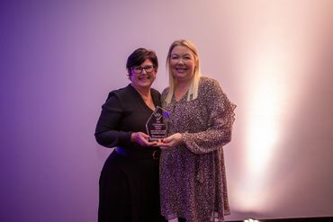 couple receiving a awards