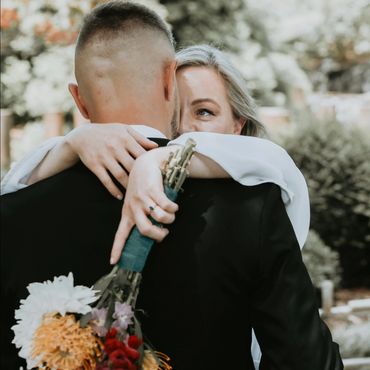 bride hugging the groom