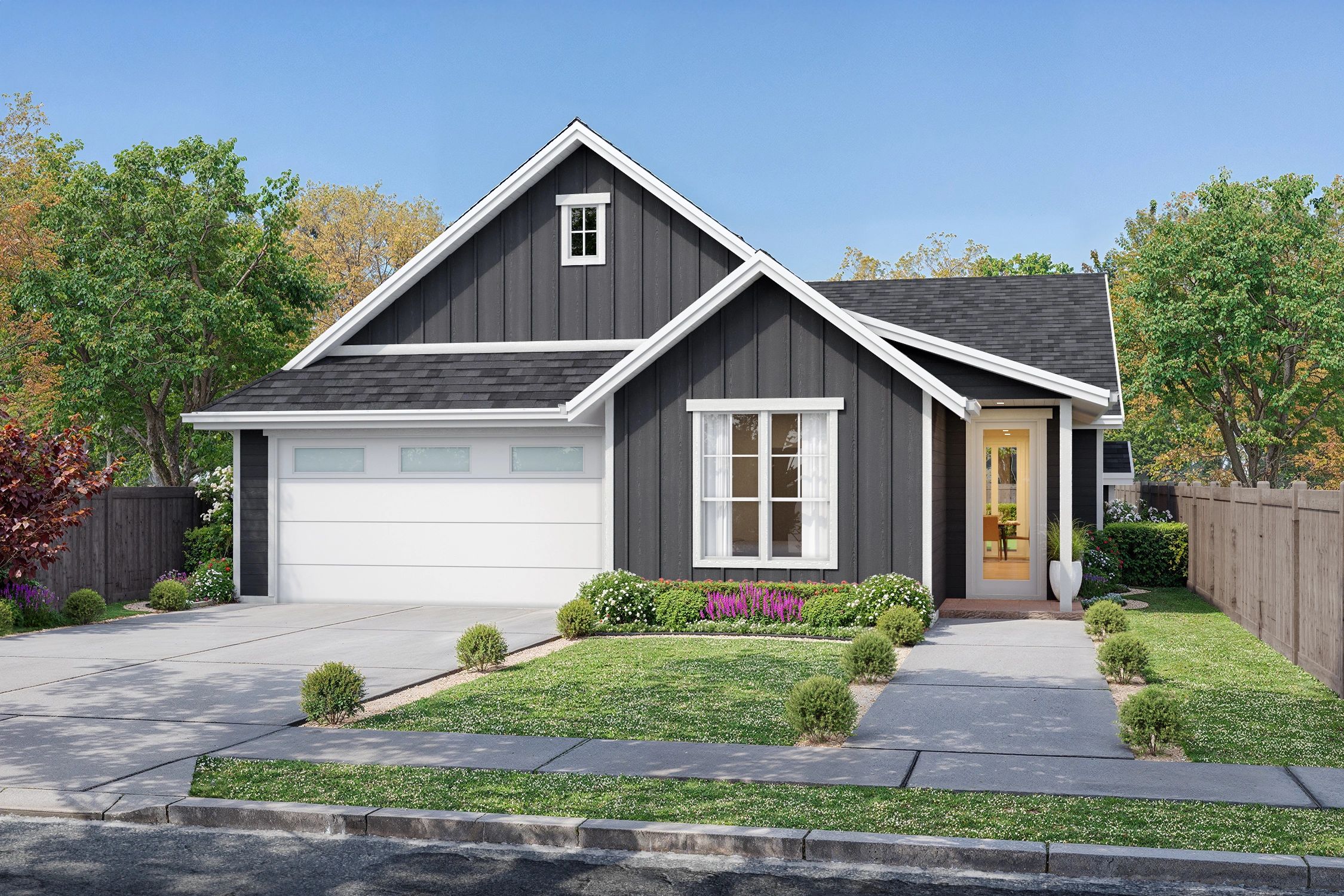 Modern gray house with white trim and lush landscaping.