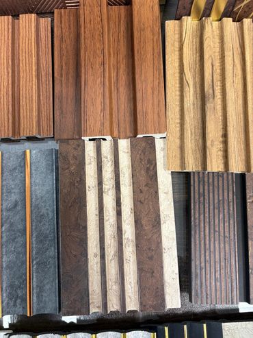 Assorted decorative wall panels with various wood and stone textures.