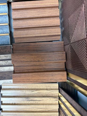 Various wood-textured panel samples in different shades and patterns.