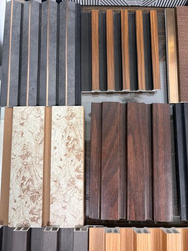 Various decorative wall panels with wood and stone textures.