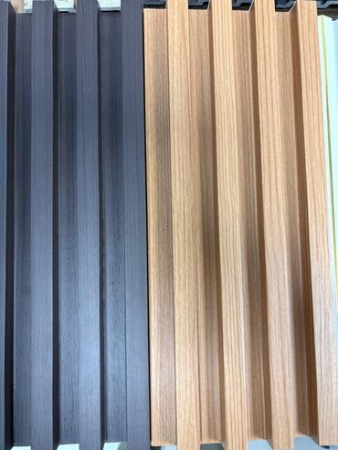 Vertical wooden slats in dark and light shades arranged side by side.