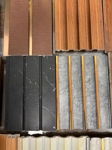 Assortment of decorative wall panels in various textures and colors.