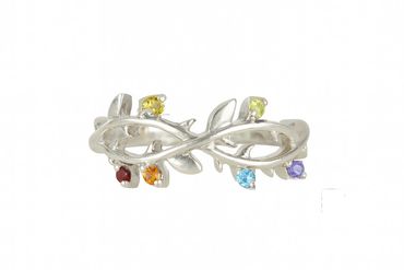 Silver infinity ring with colorful gemstones arranged like leaves.