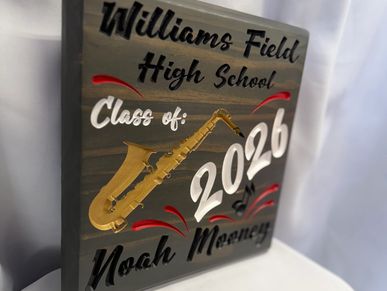 Plaque for Williams Field High School Class of 2026 with a saxophone and name Noah Mooney.