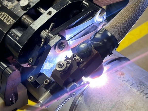 AMI model 15 orbital GTAW weldhead performing x-ray weld. 