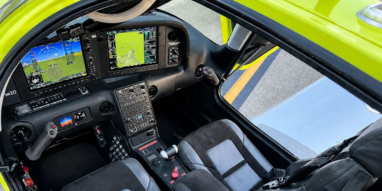 Modern aircraft cockpit with advanced digital displays.