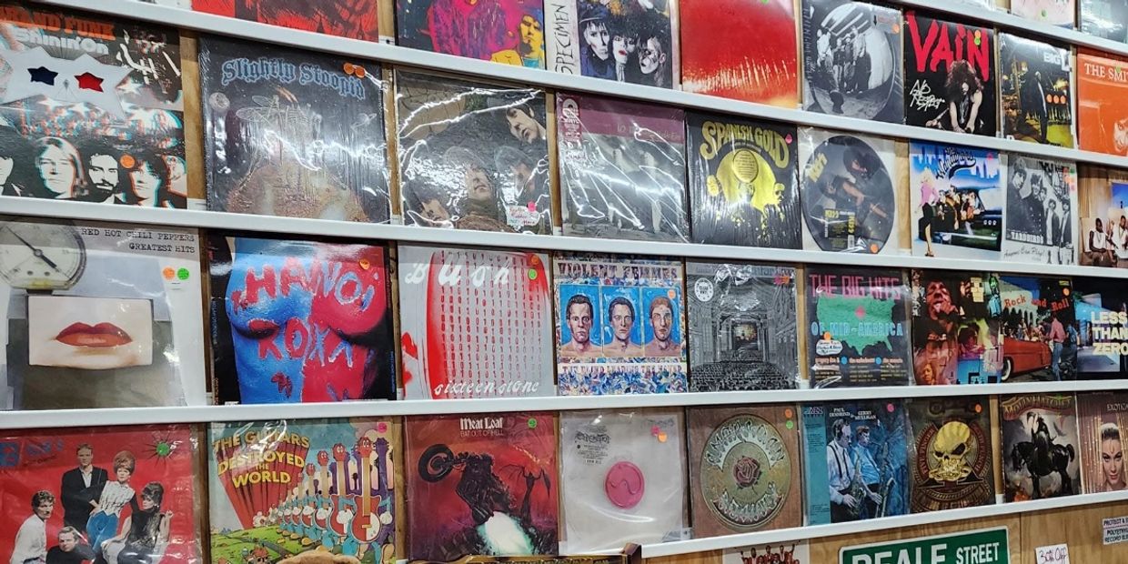 Wall and shelves filled with vinyl records in TimeFrames.