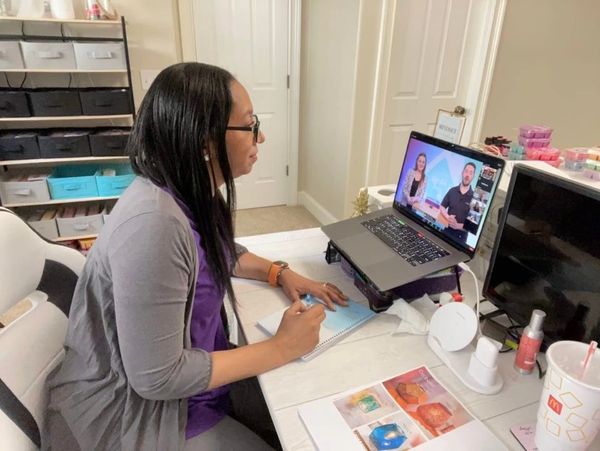 Aikya Waldo watching Scentsy training provided by the company in her home office