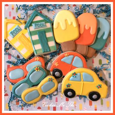 Colorful cookies shaped like cars, sunglasses, popsicles, and pool houses.