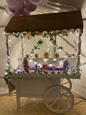 White Sweetie cart filled with sweets.