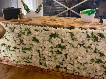 Rustic Wooden Bar with White Floral Front