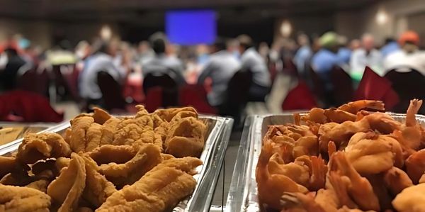 Catering event. Aluminum trays of fried catfish and jumbo shrimp.
