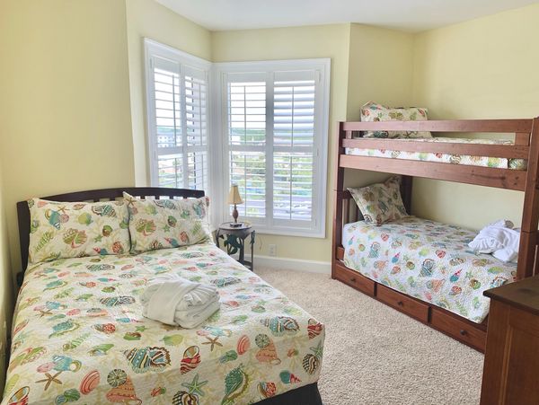 Guest Room 3 features bunk beds with a trundle and a double bed.