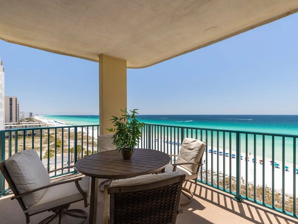 Jade East 710 private corner balcony with a view of the white sand beach and emerald ocean