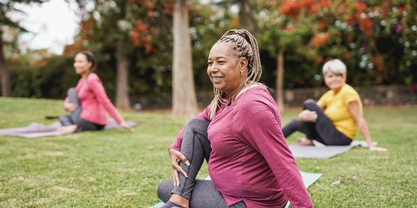 group of diverse women doing yoga
