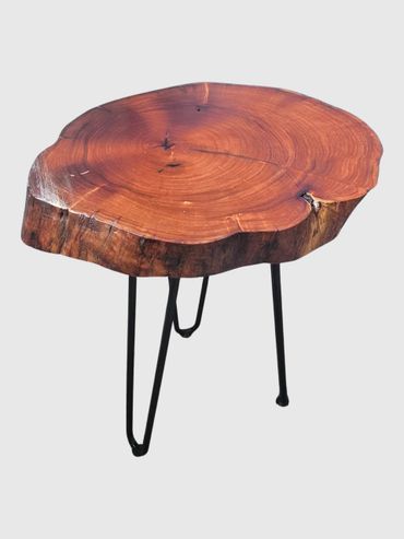 Rustic wooden slab table with metal legs.