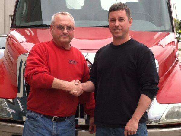 Father and son shaking hands