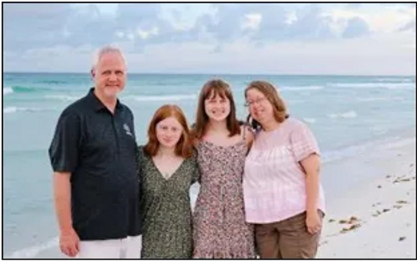 Pastor Ed Gebhart and his wife, Lisa, right, with their daughters, Autumn and Amanda