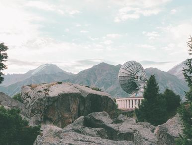 Mountain range with radio receiver in foreground