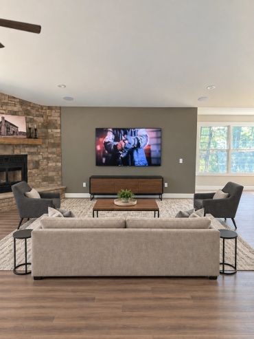 Professionally mounted TV with concealed wiring and in-ceiling speakers, creating a clean and comfor