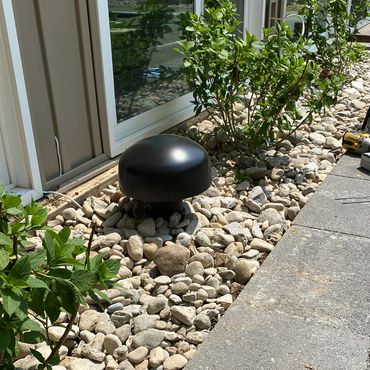 Outdoor landscaping subwoofer installation for backyard audio in Cincinnati, Ohio.