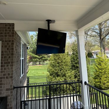 Outdoor patio TV installation with ceiling mount in Cincinnati, Ohio.