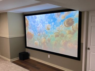Custom Home Theater Installation in Cincinnati, Ohio with fixed-frame projector screen 