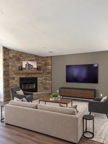 Professionally mounted TV with concealed wiring and in-ceiling speakers, creating a clean and comfor