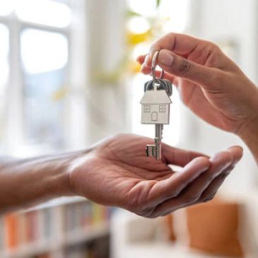 Handing over a house key.