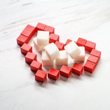 A red heart with sugar cubes inside to represent taking control of your diabetes.