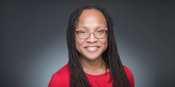 Angela Wilson portrait introducing founder bio and linking visitors to her full executive leadership