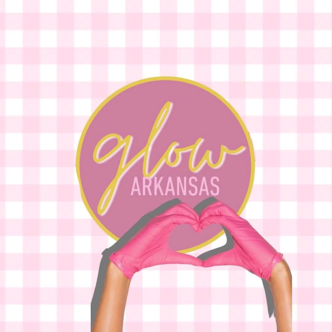 Hands in pink gloves forming a heart shape over a glow Arkansas logo.