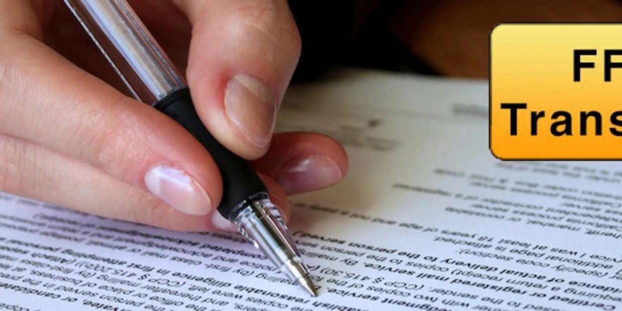 Person signing a document labeled FFL Transfers.
