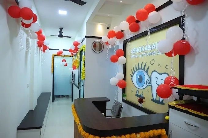 Decorated dental clinic reception with balloons and garlands.