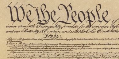 The opening lines of the United States Constitution titled 'We the People'.