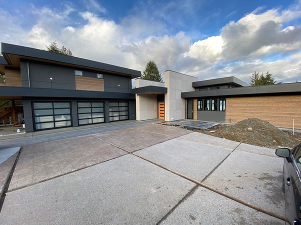 Triple car garage with etensive finishes inside.