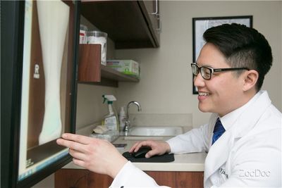 Doctor examining x-rays.
