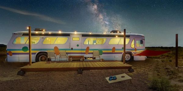 Old bus converted into a glamping RV in the high desert of Arizona.