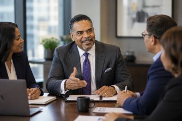 Business meeting with diverse professionals discussing.