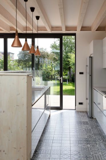 New bespoke kitchen with exposed timber beams in a house in Enfield, North London.