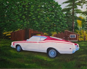 Classic white muscle car with red stripes parked on grass near wooden buildings.