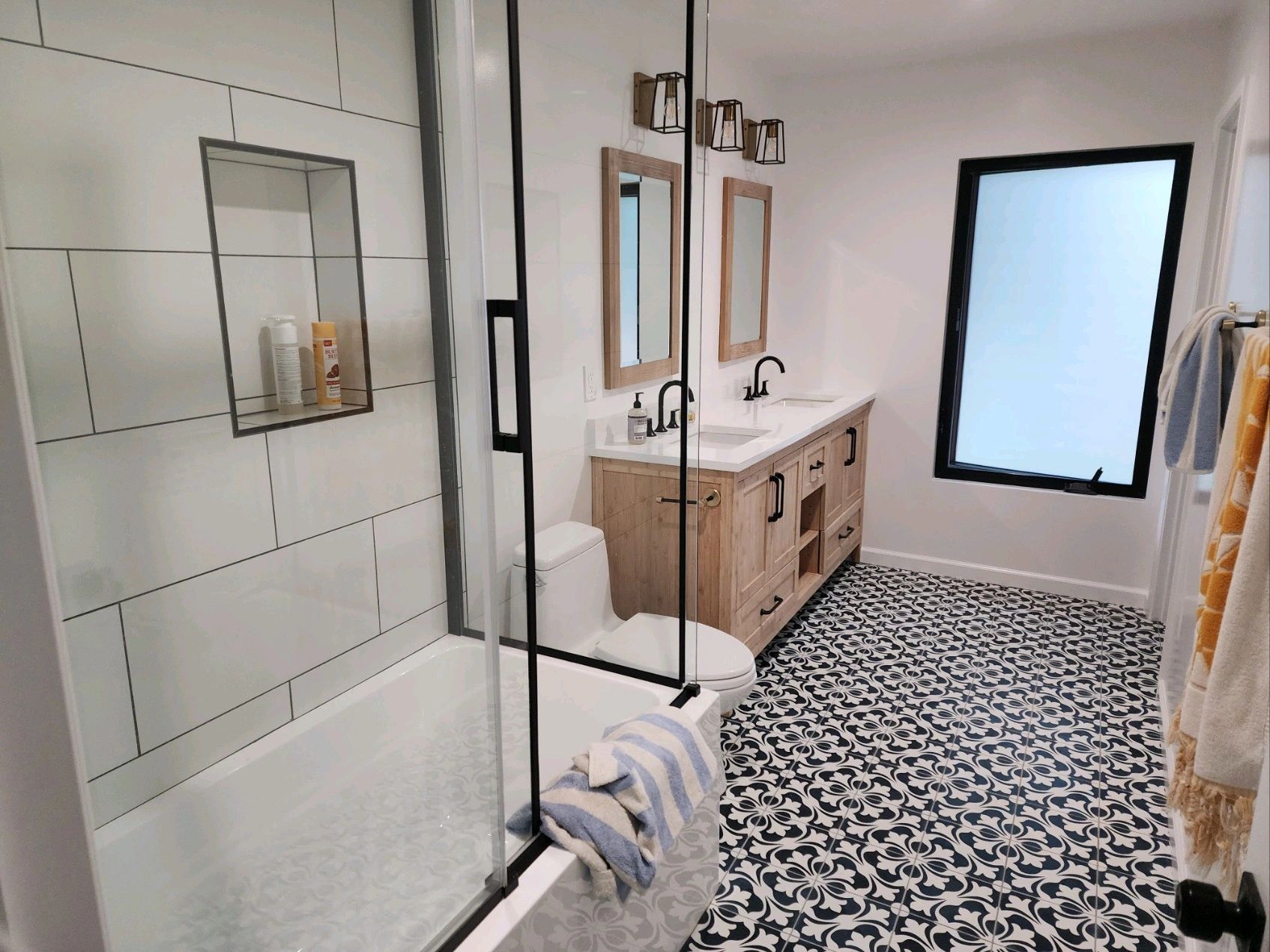 custom bathroom remodel  custom Milgard window, signature hardware vanity, floor and decor tile.  