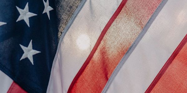 Close-up of the American flag waving in the wind.
