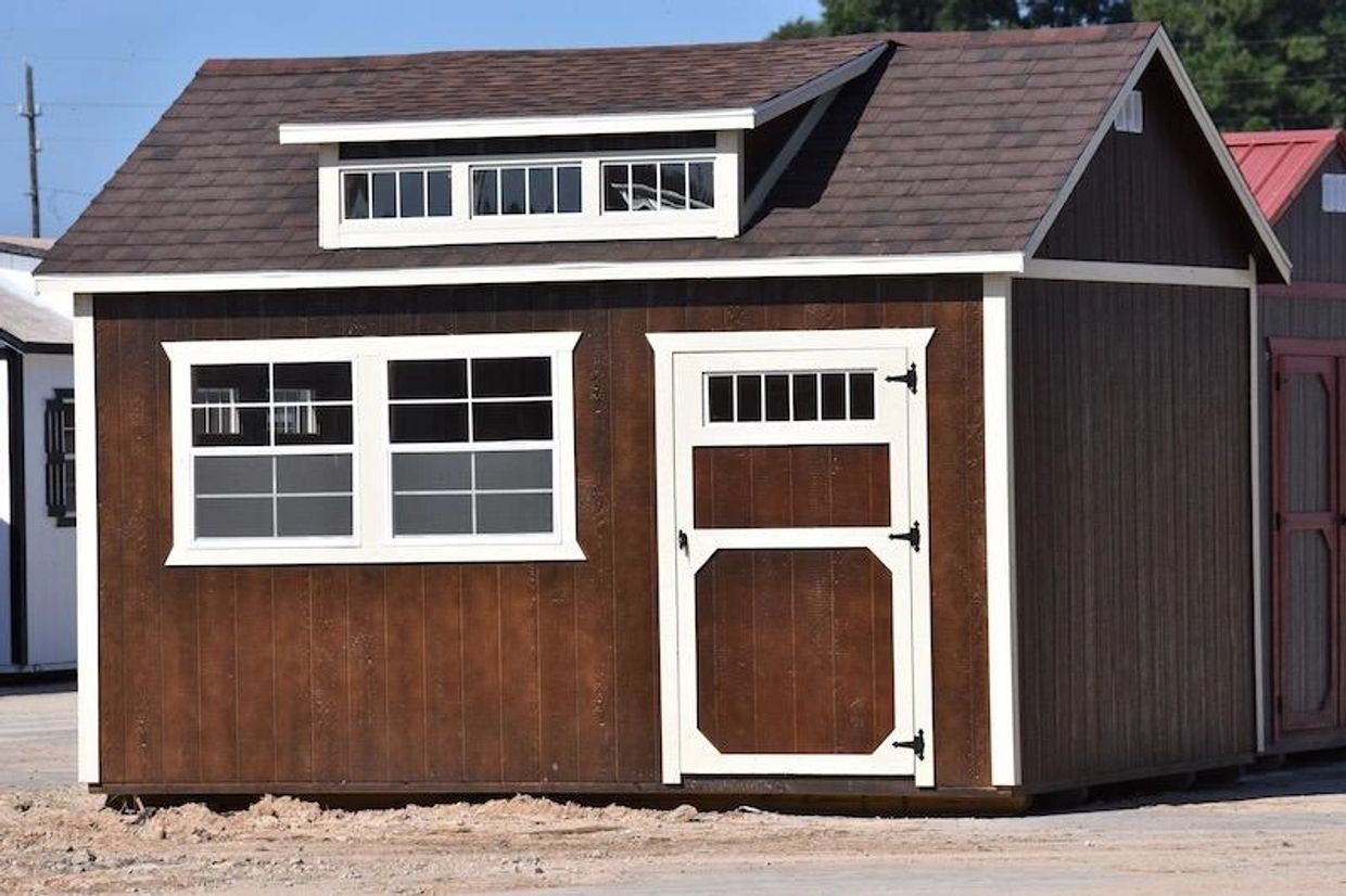 Garden shed with single door, double windows and dormer in Giddings, Texas at Tiny Hive