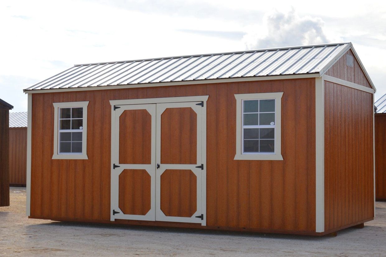 Side utility shed building with double shop doors in Giddings, Texas