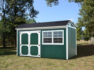 Green Derksen shed for backyards at Tiny Hive in Giddings, TX