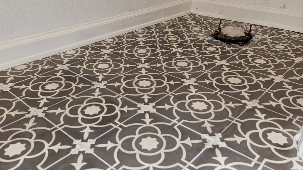 Considerate Handyman image of custom tile installation and baseboard replacement. 